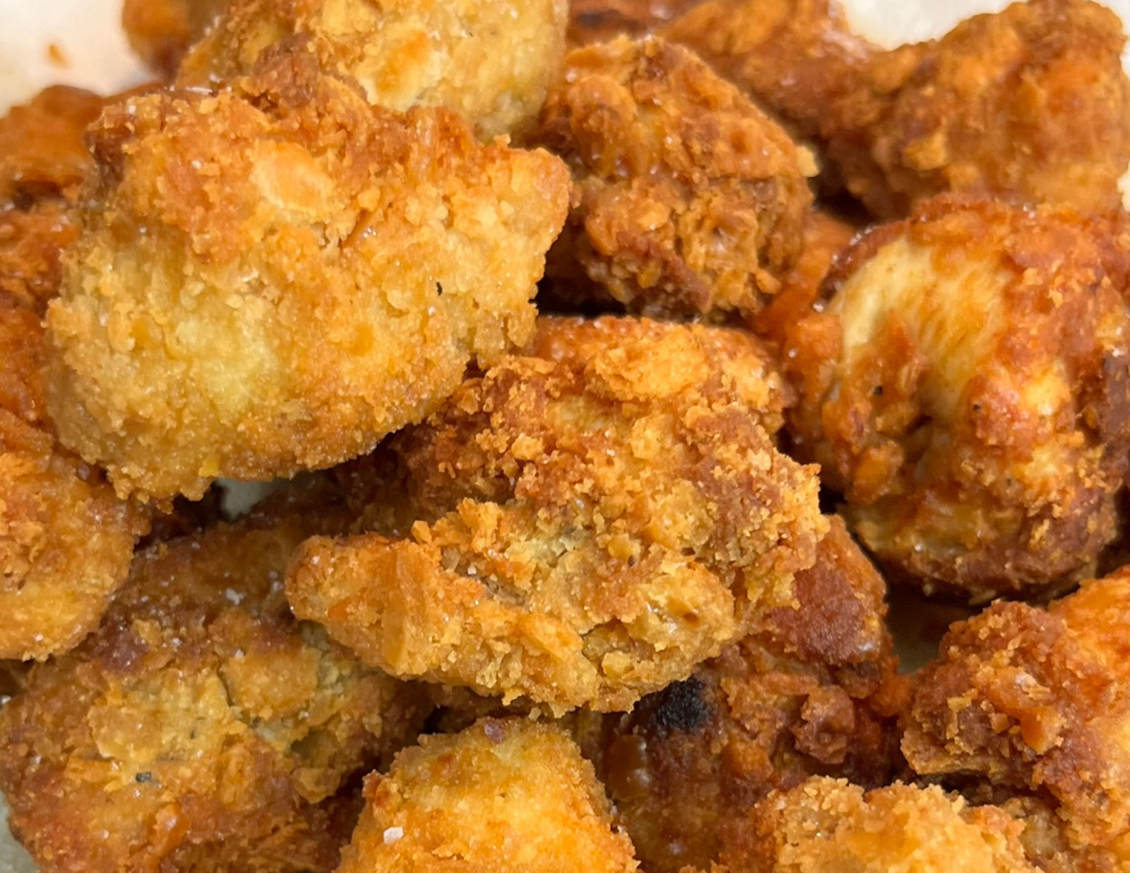 Crispy fried chicken nuggets coated in Ritz crackers